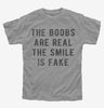 The Boobs Are Real The Smile Is Fake Kids Tshirt 089f0c61-59cd-4644-b26f-0a90c09597f4 666x695.jpg?v=1700591242